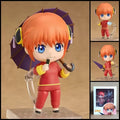 Kagura GINTAMA chibi action figure with orange hair, red Chinese-style outfit, purple umbrella, character accessories, and clear display base.