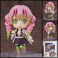 Mitsuri Kanroji DEMON SLAYER chibi action figure with pink-and-green braided hair, Demon Slayer uniform, flexible sword accessory, character accessories, and display base.