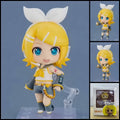Kagamine Rin VOCALOID chibi action figure with blonde hair, oversized white bow, yellow-and-black outfit, character-themed accessories, and clear display base.