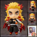Kyojuro Rengoku DEMON SLAYER chibi action figure with flame-coloured hair, Flame Hashira haori, Nichirin sword, interchangeable parts, and clear display base.