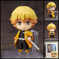 Zenitsu Agatsuma DEMON SLAYER chibi action figure with yellow-orange hair, triangle-pattern haori, Nichirin sword, interchangeable parts, and clear display base.