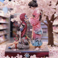 DEMON SLAYER Akaza Hakuji and Koyuki PVC statue featuring an emotional embrace, detailed demon markings, kimono styling and translucent cherry blossom effects.
