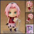 NARUTO Sakura Haruno chibi action figure – 10 cm PVC anime figure with pink hair, green eyes, red ninja outfit, Konoha headband and interchangeable parts.